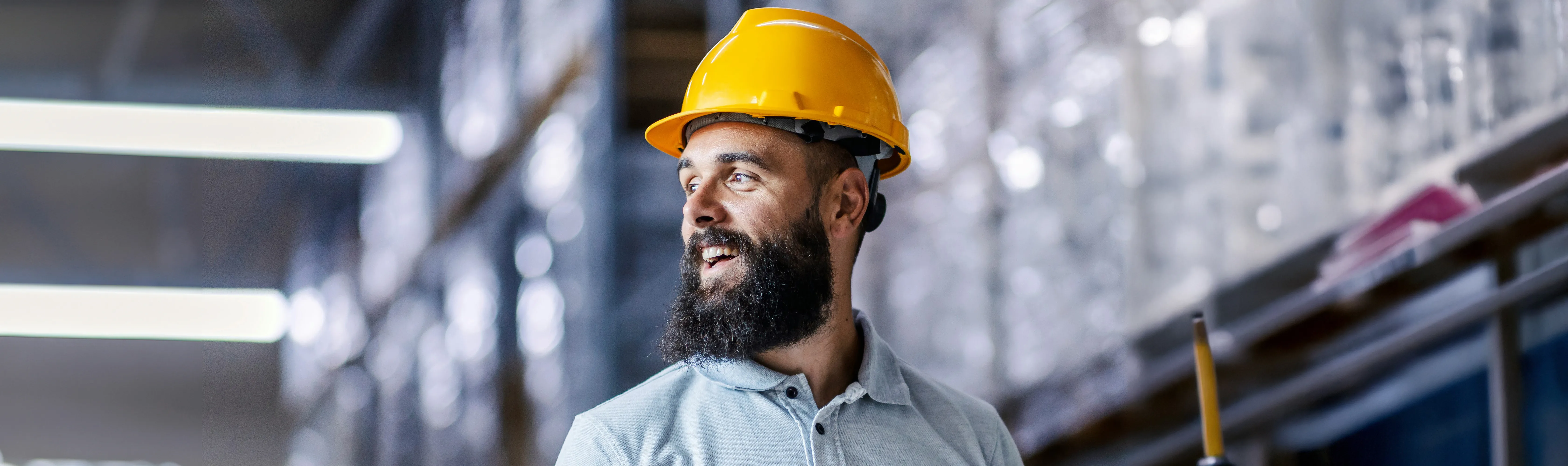 Man in warehouse wearing PPE